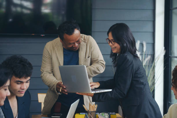 Group of business people plan annual budget report and work to solution strategy during brainstorming meeting. Collaborate of Professional Businessman and team at office. Strategy Business concept.